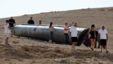 Remains of a ballistic missile lying in the desert, following an attack by Iran on Israel, near the southern city of Arad